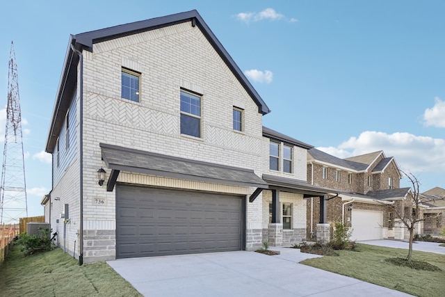 view of front of home with a front lawn and a garage