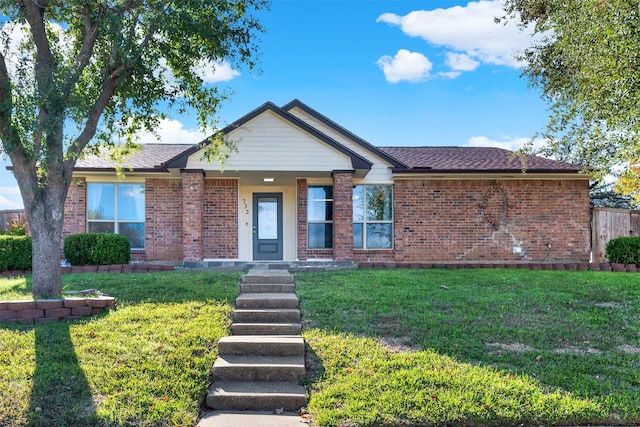 single story home featuring a front lawn