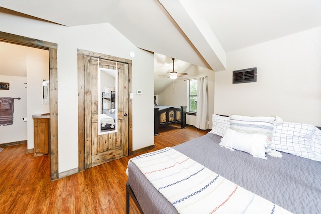 bedroom with hardwood / wood-style floors, vaulted ceiling, and ceiling fan