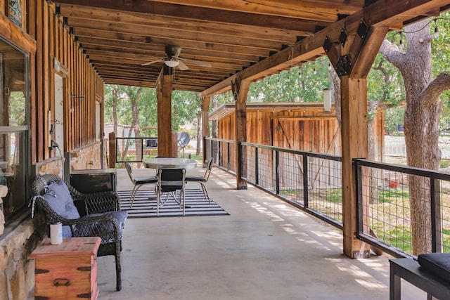 view of patio / terrace with ceiling fan and an outbuilding