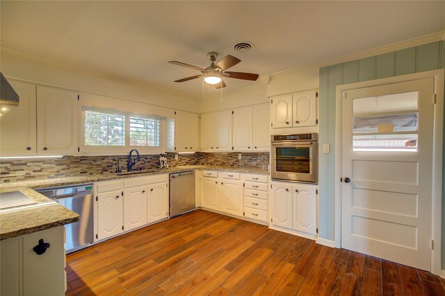 kitchen featuring sink, white cabinets, and stainless steel appliances