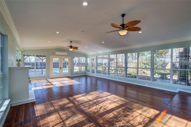 interior space featuring a wall mounted air conditioner, french doors, vaulted ceiling, and ceiling fan