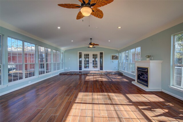 unfurnished sunroom featuring ceiling fan, lofted ceiling, a wealth of natural light, and french doors