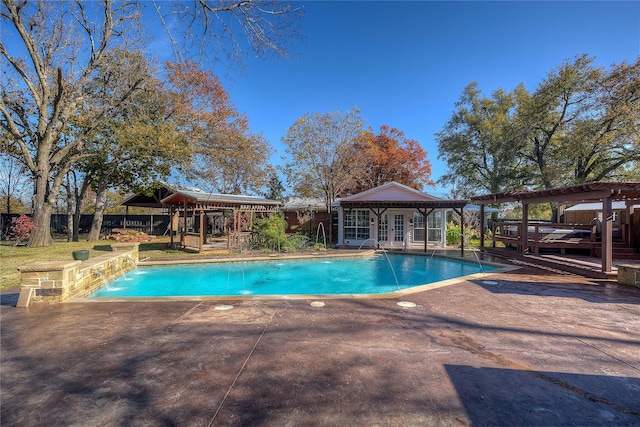 view of pool featuring pool water feature and a patio