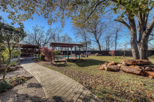 view of yard with a patio and a swimming pool