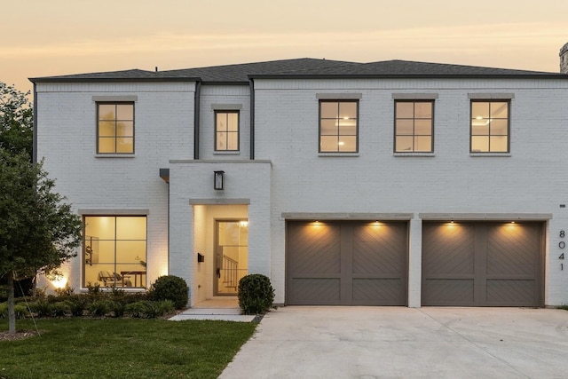 view of front facade featuring a yard and a garage