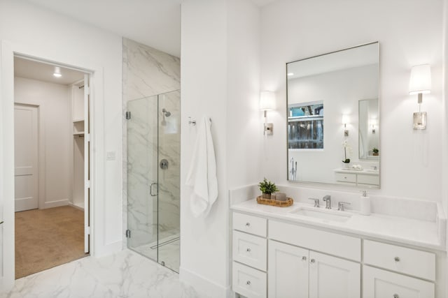 bathroom featuring vanity and a shower with shower door