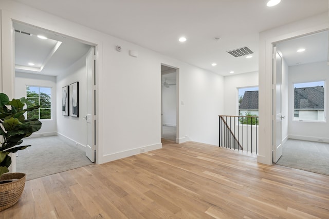 empty room with light hardwood / wood-style flooring