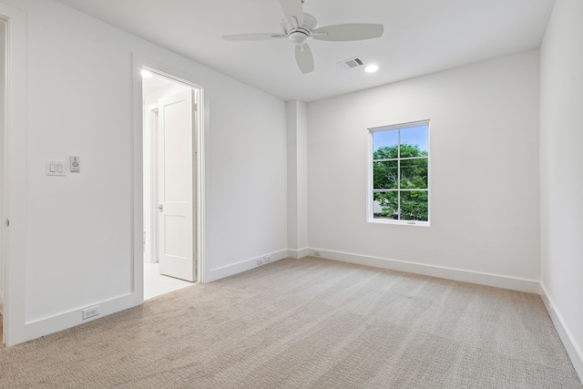 carpeted empty room with ceiling fan