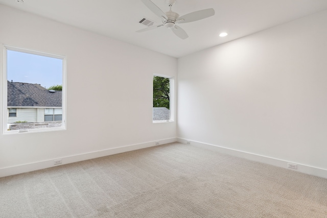 spare room with carpet and ceiling fan