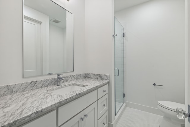 bathroom featuring tile patterned floors, a shower with door, vanity, and toilet