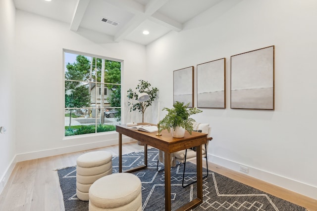 office featuring hardwood / wood-style floors and beamed ceiling