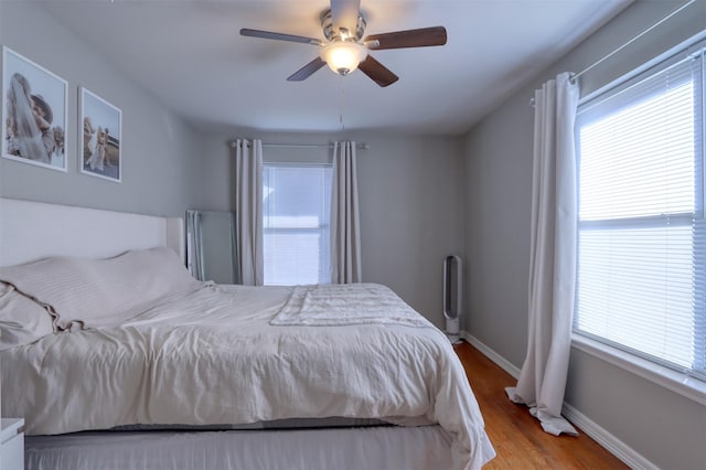 bedroom featuring light hardwood / wood-style flooring and ceiling fan