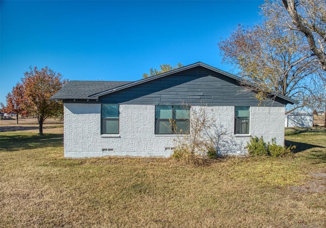 view of property exterior with a lawn