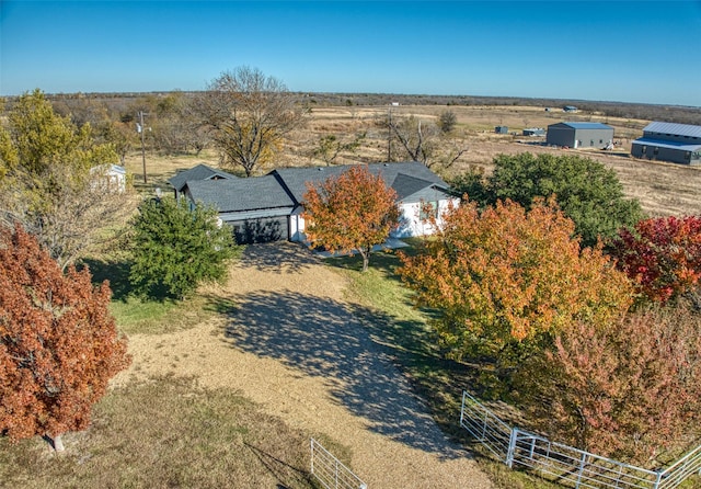 birds eye view of property with a rural view