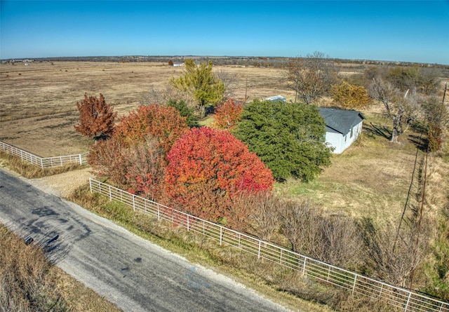 birds eye view of property with a rural view