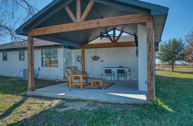 view of patio / terrace featuring a gazebo and ceiling fan