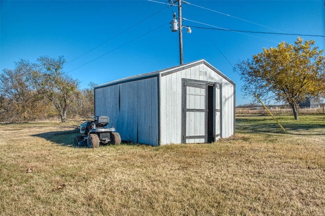 view of outdoor structure with a yard