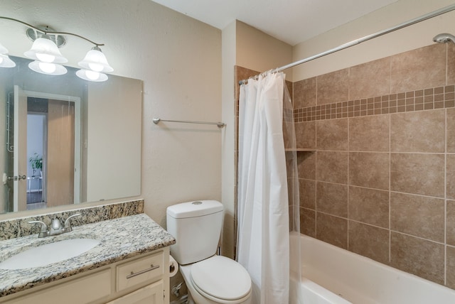 full bathroom with vanity, shower / bath combination with curtain, and toilet