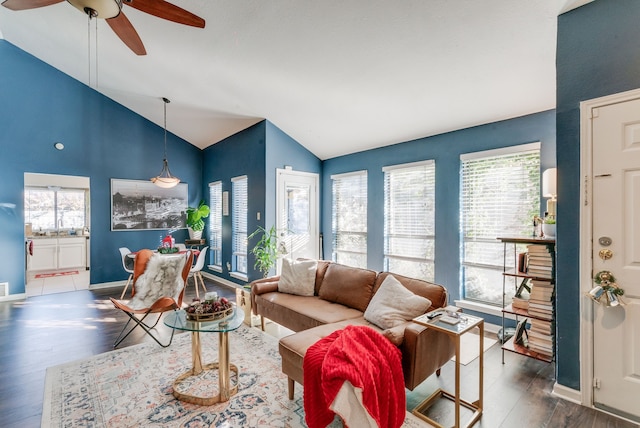 living room featuring ceiling fan, high vaulted ceiling, and dark hardwood / wood-style floors