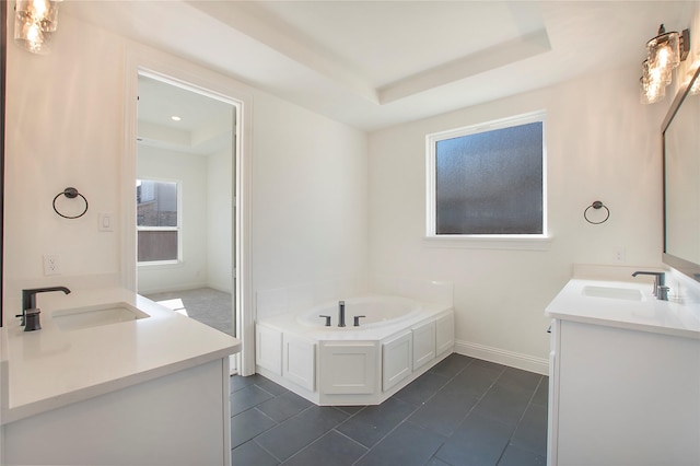 bathroom featuring vanity, a bath, tile patterned floors, and a raised ceiling