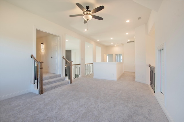 spare room featuring light colored carpet