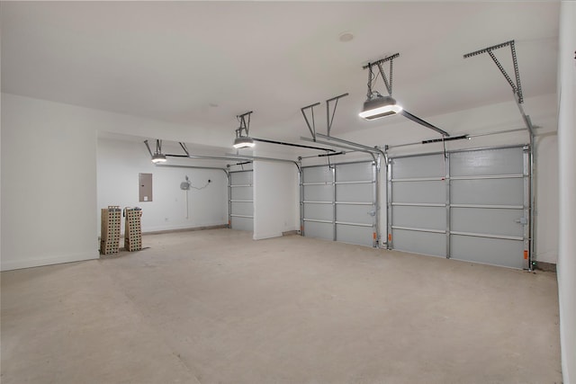 garage featuring a garage door opener and electric panel