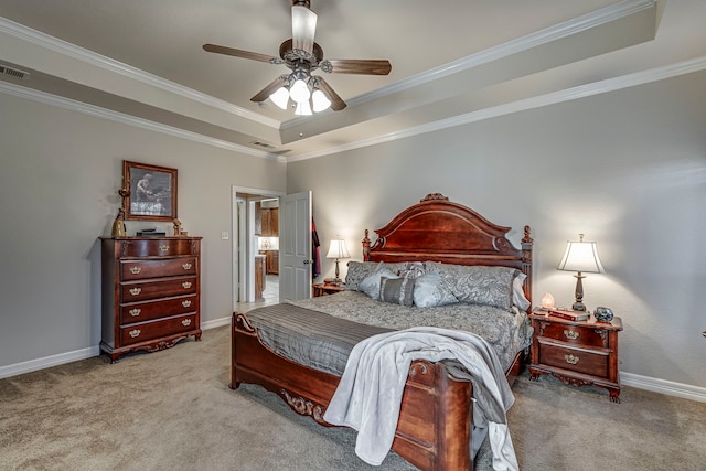 carpeted bedroom with a raised ceiling, ceiling fan, and ornamental molding