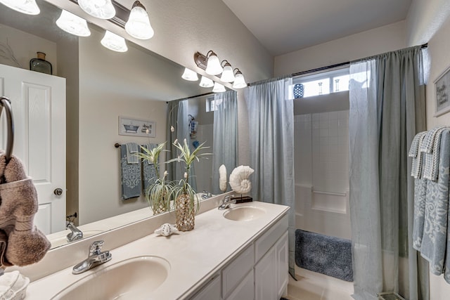 bathroom featuring vanity and curtained shower