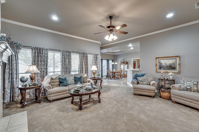 carpeted living room with crown molding and ceiling fan