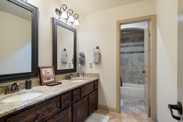 bathroom featuring vanity and tiled shower / bath combo