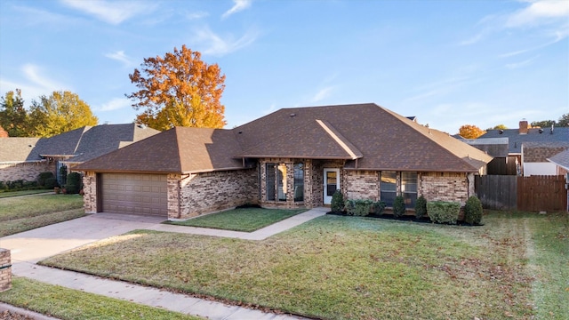 ranch-style house featuring a front lawn and a garage