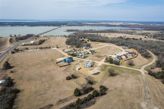 birds eye view of property featuring a rural view and a water view