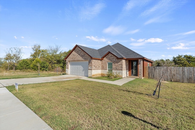 single story home with concrete driveway, fence, a front yard, a garage, and brick siding