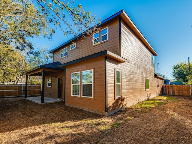 back of property with a patio area