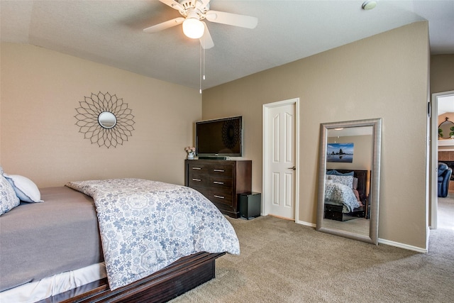 bedroom with lofted ceiling, light colored carpet, and ceiling fan