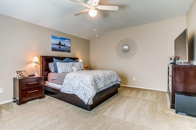 carpeted bedroom featuring lofted ceiling and ceiling fan