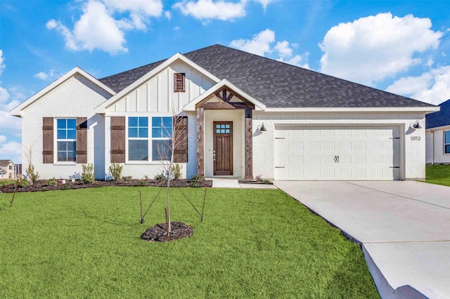 view of front of property featuring a shingled roof, an attached garage, board and batten siding, driveway, and a front lawn