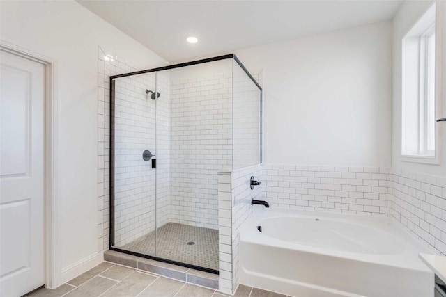 11712 Blackfoot Ct, Godley, TX 76044 - full bath featuring a garden tub, a stall shower, plenty of natural light, tile patterned floors, and recessed lighting