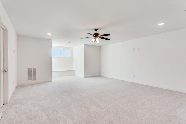11712 Blackfoot Ct, Godley, TX 76044 - spare room featuring light colored carpet, recessed lighting, ceiling fan, and baseboards