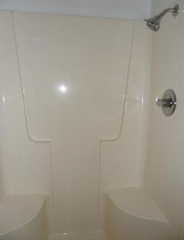 bathroom featuring walk in shower