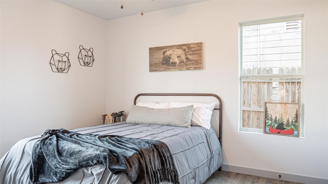 bedroom with wood-type flooring