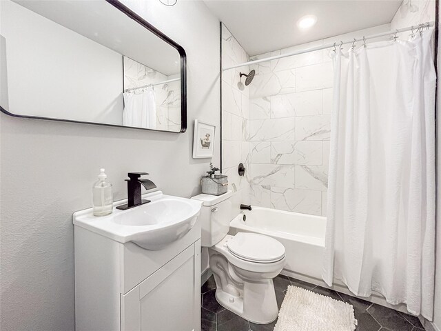 full bathroom featuring tile patterned flooring, vanity, toilet, and shower / bath combo