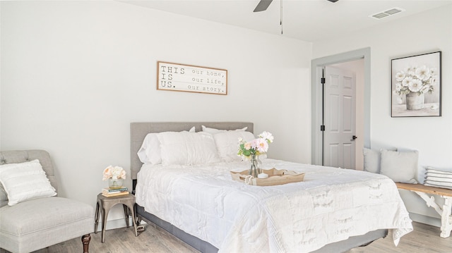 bedroom featuring ceiling fan and light hardwood / wood-style floors