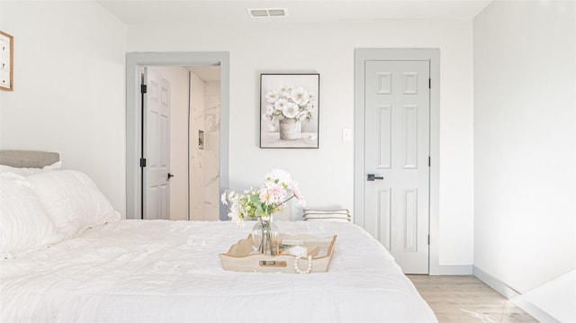 bedroom featuring light hardwood / wood-style floors