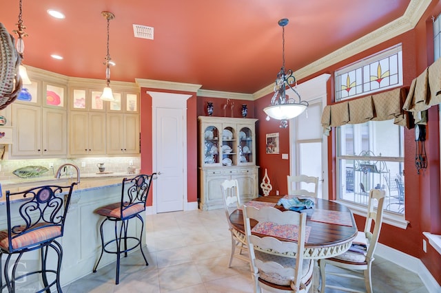 tiled dining area with ornamental molding