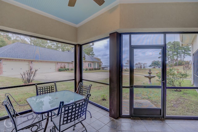 sunroom / solarium featuring ceiling fan