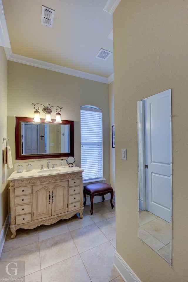 bathroom with tile patterned flooring, vanity, and ornamental molding