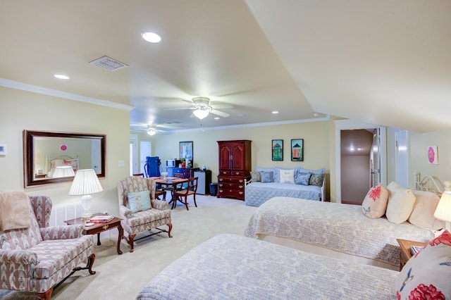 carpeted bedroom with ceiling fan and ornamental molding