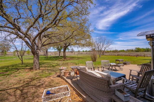 view of yard featuring a rural view and a patio